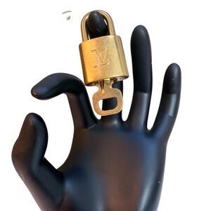 Louis Vuitton Luxurious Gold Lock #323